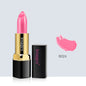 Pink lipstick with gold and black casing on a light gray background